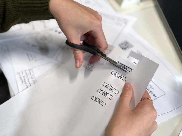 Friendly blogger holding notebook with subscription tracking list